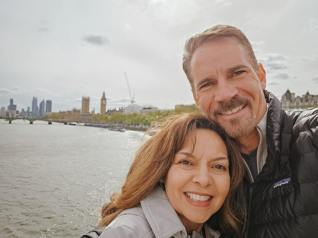 Terry Tamashiro Harris and her husband Wayne Harris smiling together on a trip